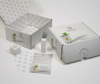 close up of white woodford boxes with one pager